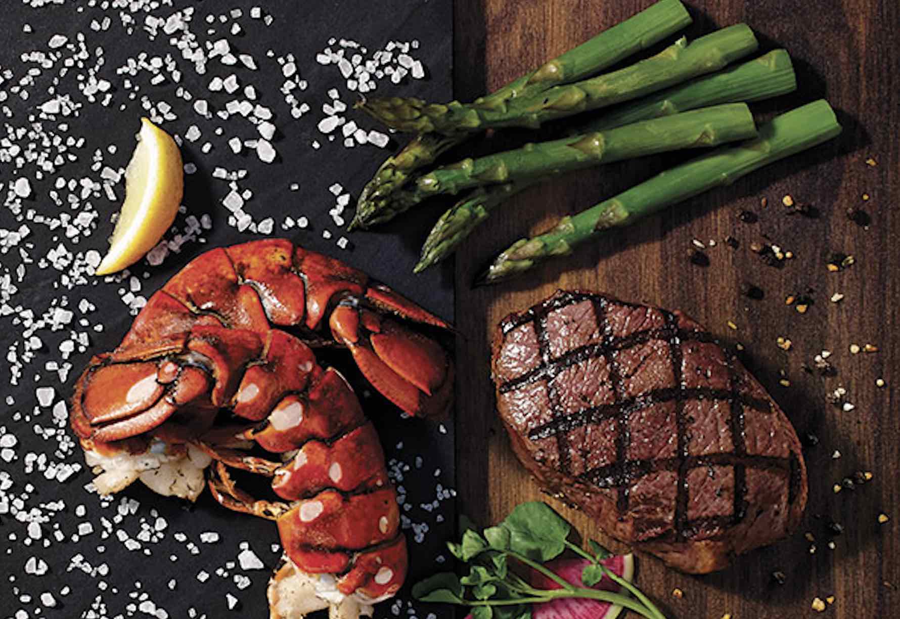Baton Rouge Steakhouse and Bar seafood and steak on a cutting board