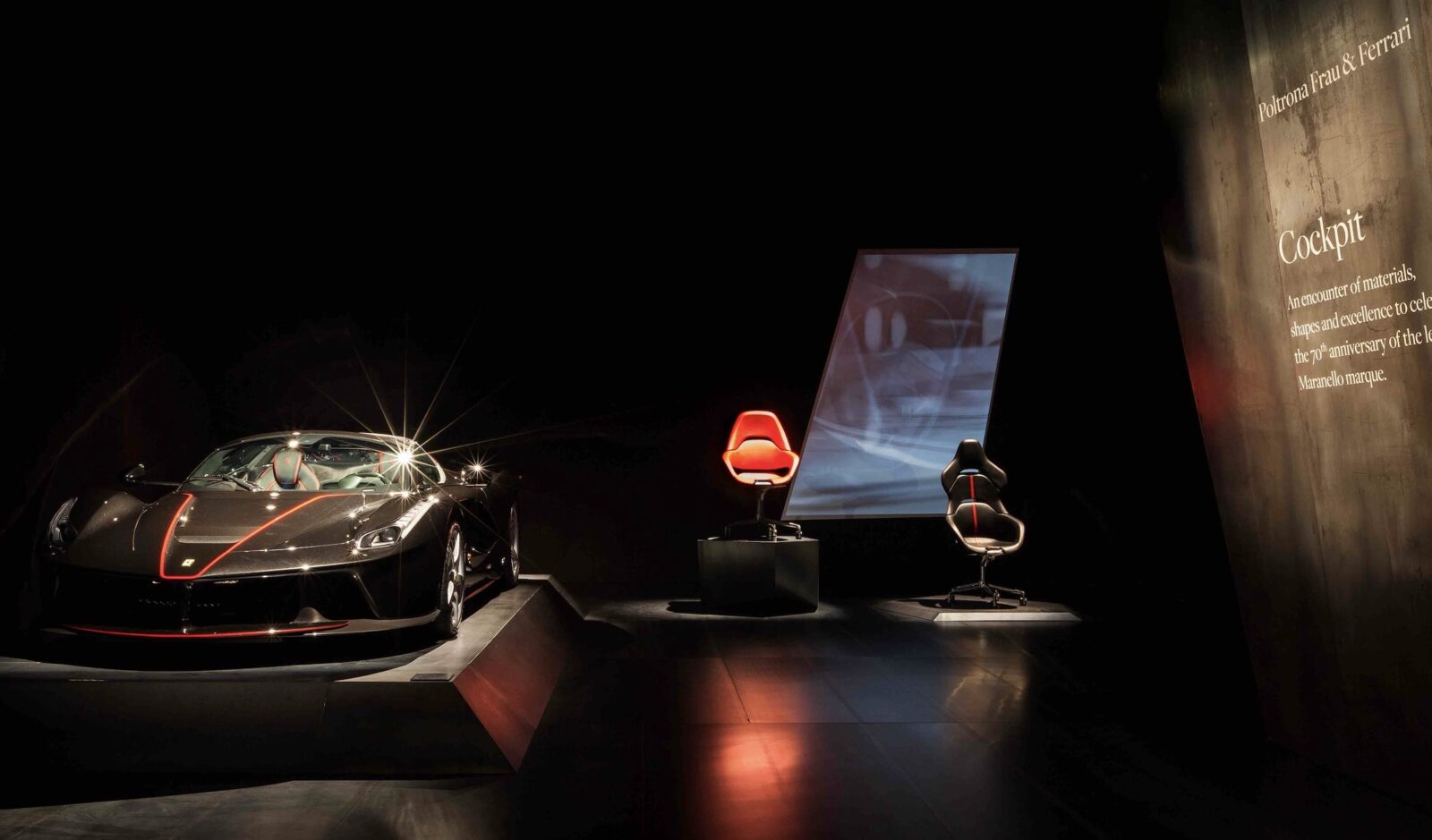 Ferrari office chairs on stage with car